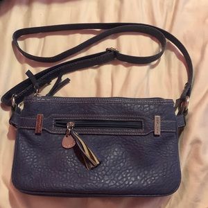 this a a dark blue Rosetti shoulder bag